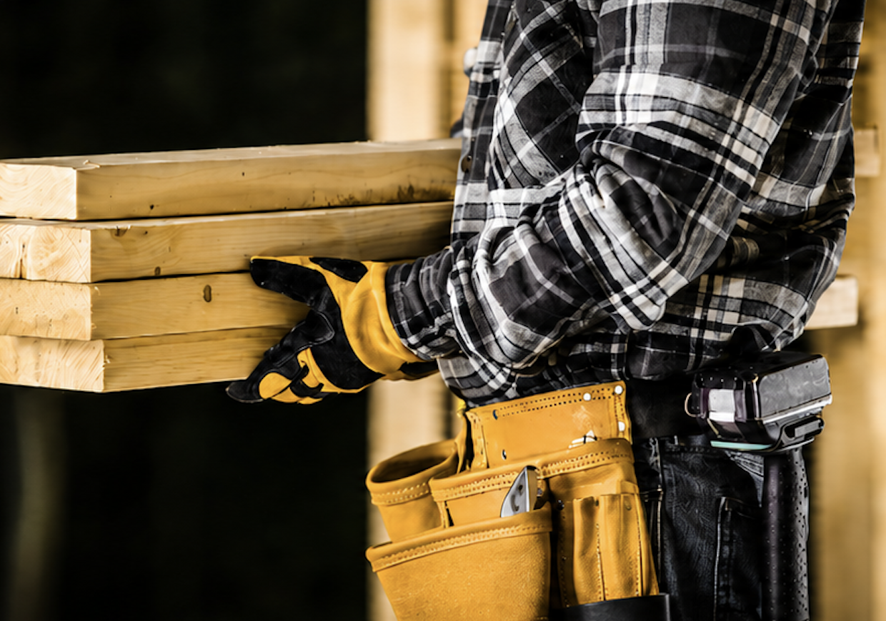 Contractor with lumber and tools